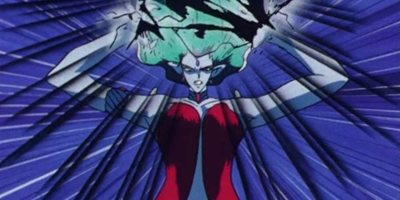 A closeup shows Super Beryl aiming dark lightning at Princess Serenity in the anime Sailor Moon.