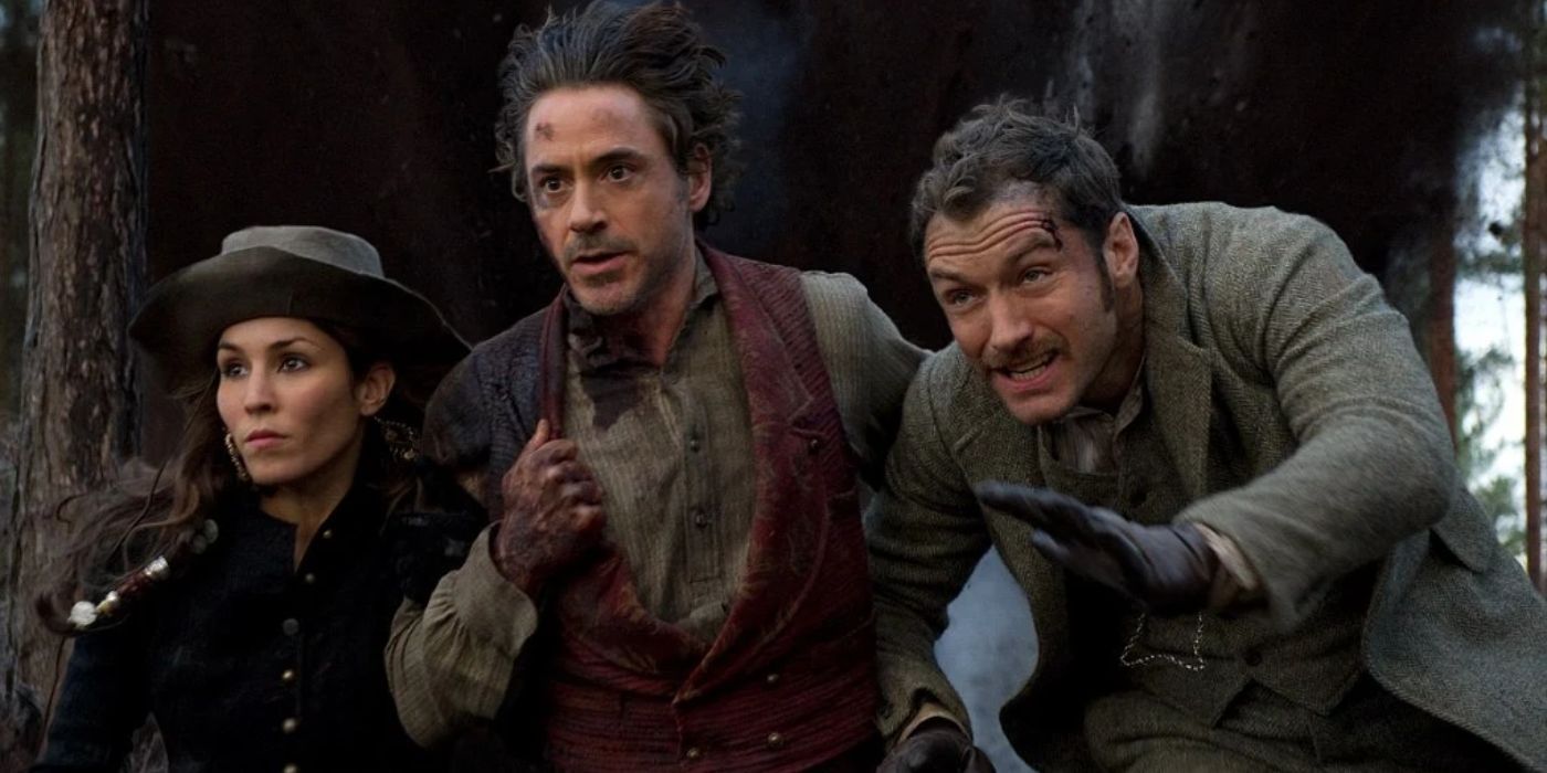 Simza, Sherlock, and Watson run from heavy fire in Sherlock Holmes: A Game of Shadows.