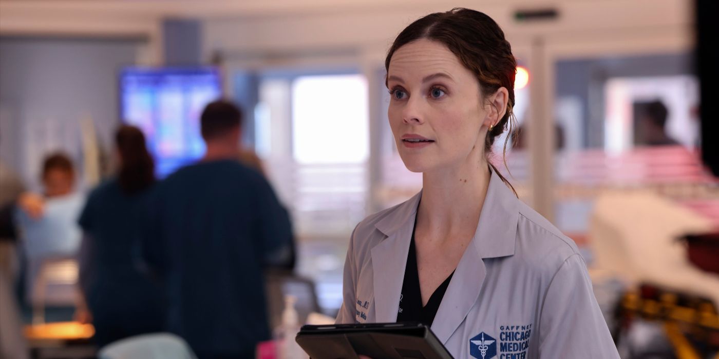 Dr. Caitlin Lenox, played by Sarah Ramos, wears a lab coat and holds a clipboard on Chicago Med