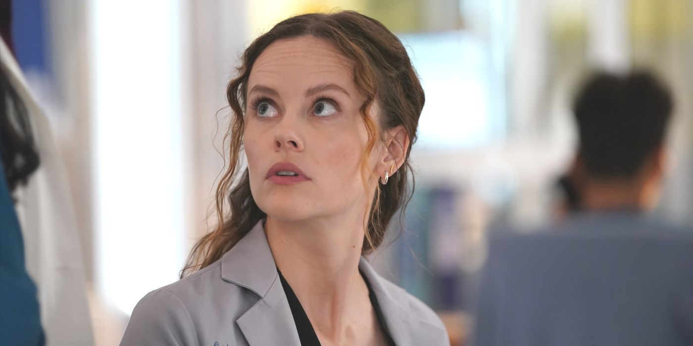 Caitlin Lenox, played by Sarah Ramos, in a lab coat looking up in Chicago Med Season 10