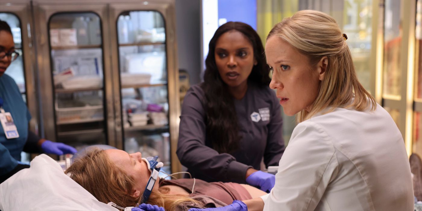 Dr. Hannah Asher (Jessy Schram) and Maggie (Marlyne Barrett) stand over a patient on Chicago Med