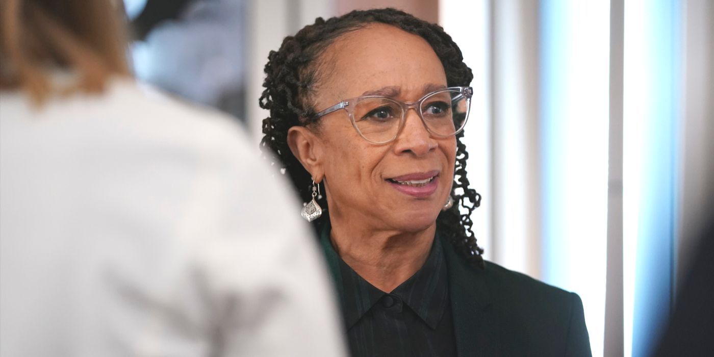 Sharon Goodwin, played by S. Epatha Merkerson, stands in a crowd of doctors on Chicago Med