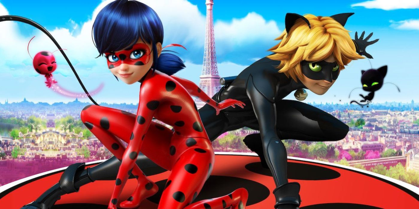 Ladybug and Cat Noir pose with Tikki and Plagg in front of Paris in promotional art for Miraculous Ladybug.