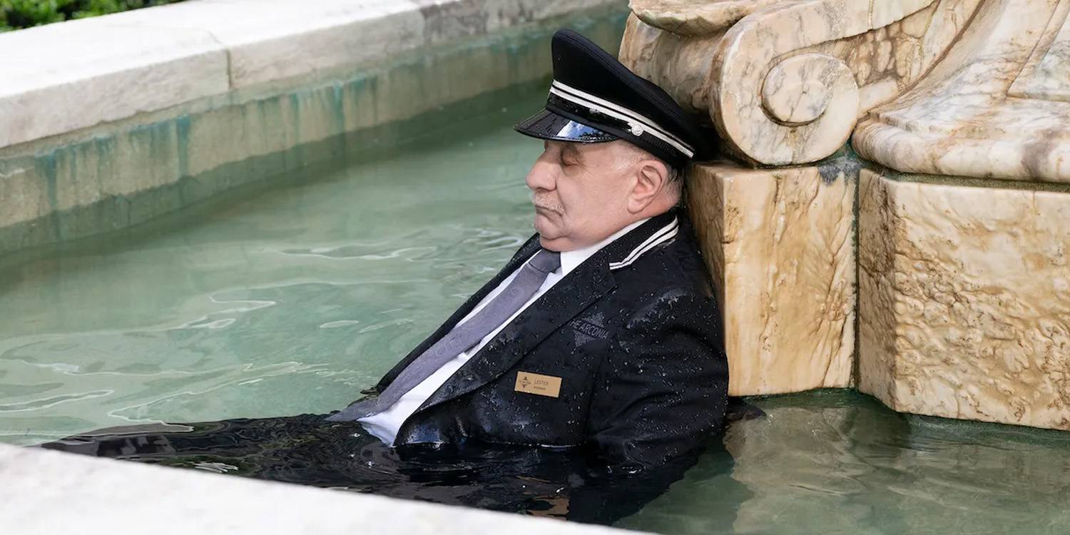 The doorman Lester dead in the Arconia's fountain on Only Murders in the Building.