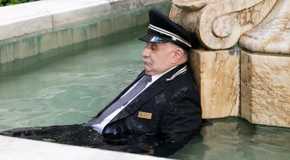 The doorman Lester dead in the Arconia's fountain on Only Murders in the Building.
