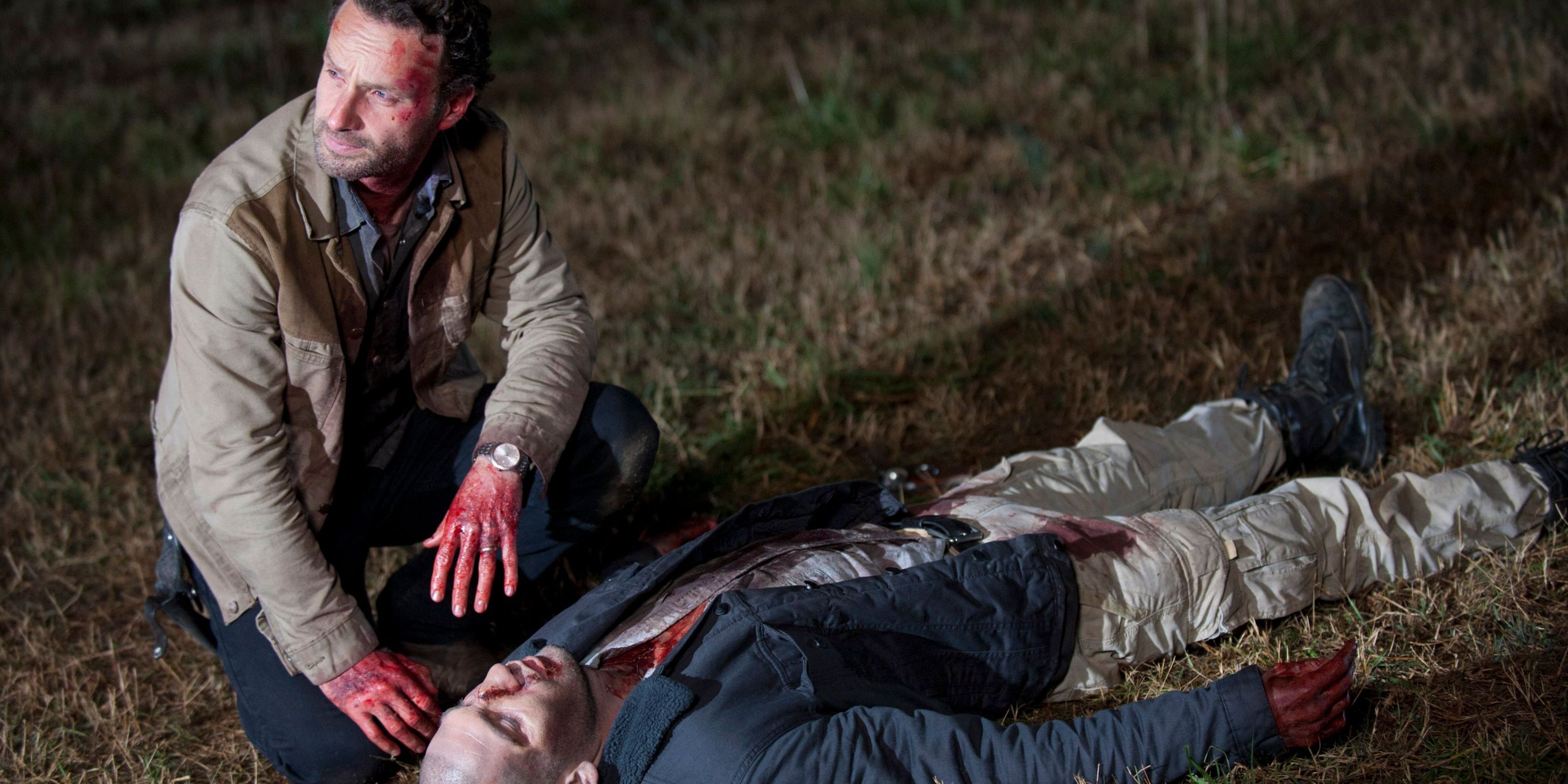 Rick sits next to Shane's body in The Walking Dead Cropped