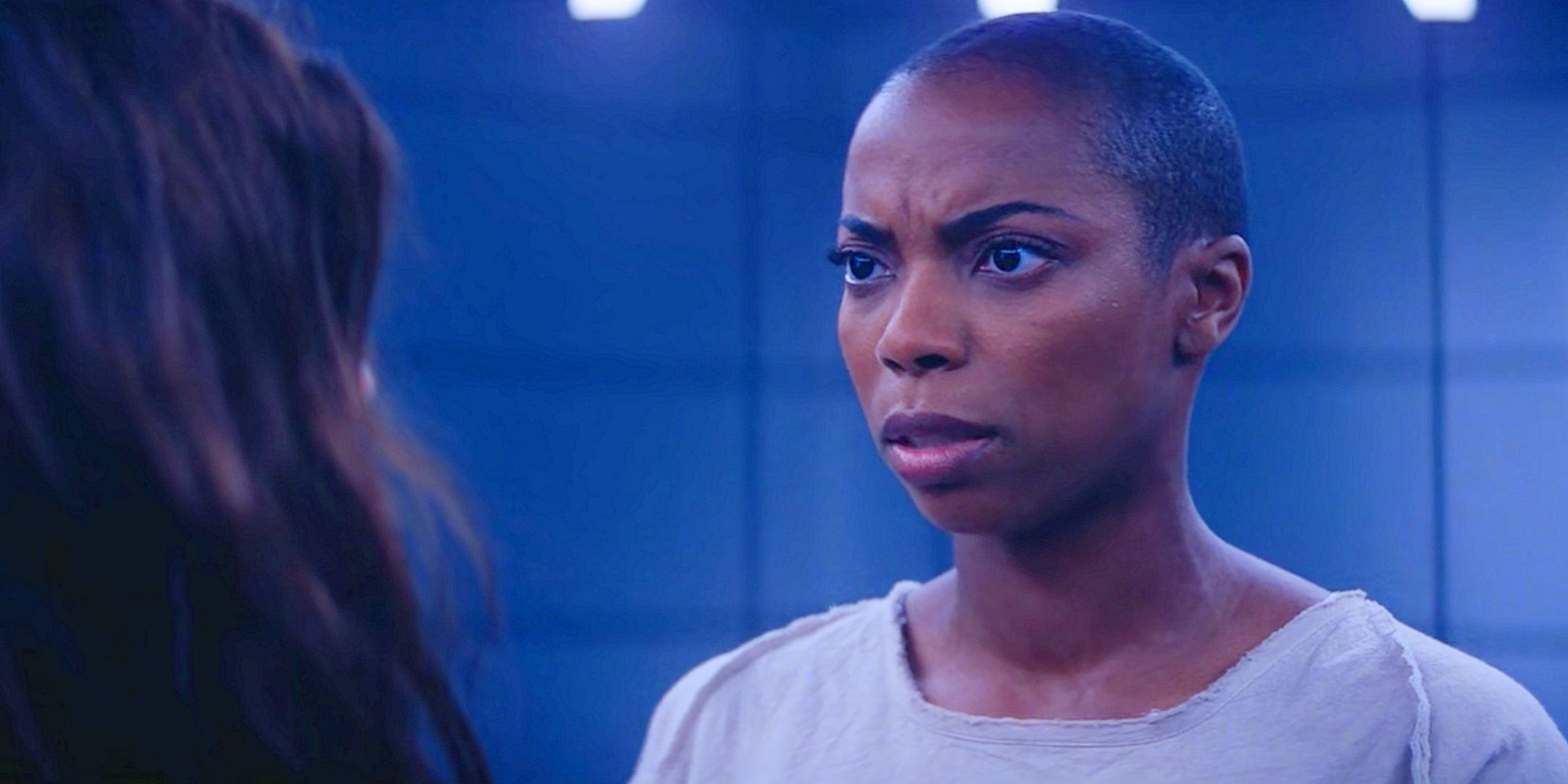 Sasheer Zamata as Jennifer Kale watches Agatha Harkness (back on camera) in the no-commitment ritual of Agatha All Along