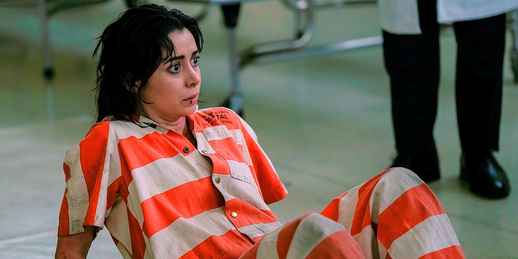 Sofia Falcone, played by Cristin Milioti, wears a prison jumpsuit while on the floor in The Penguin