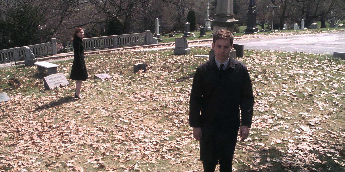 Peter walks away from MJ in a cemetery