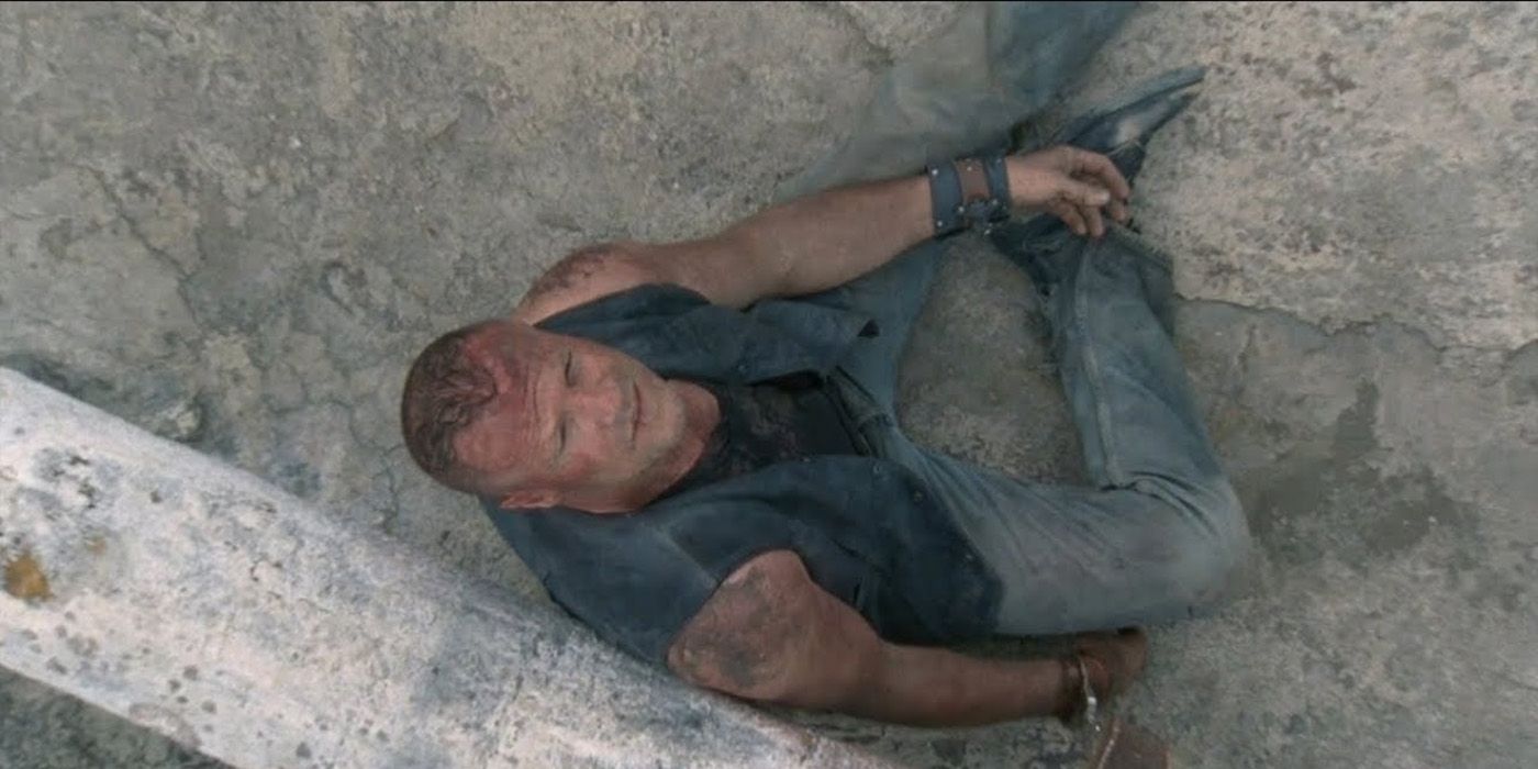 An overhead shot of Merle looking up while handcuffed on the roof in The Walking Dead.