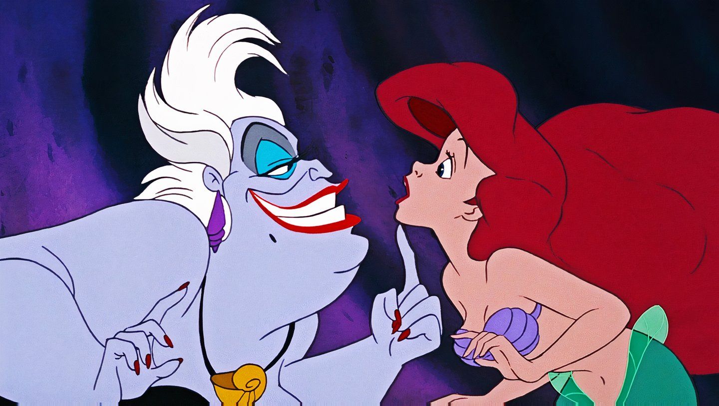 Ursula placing her hand on Ariel's chin in The Little Mermaid