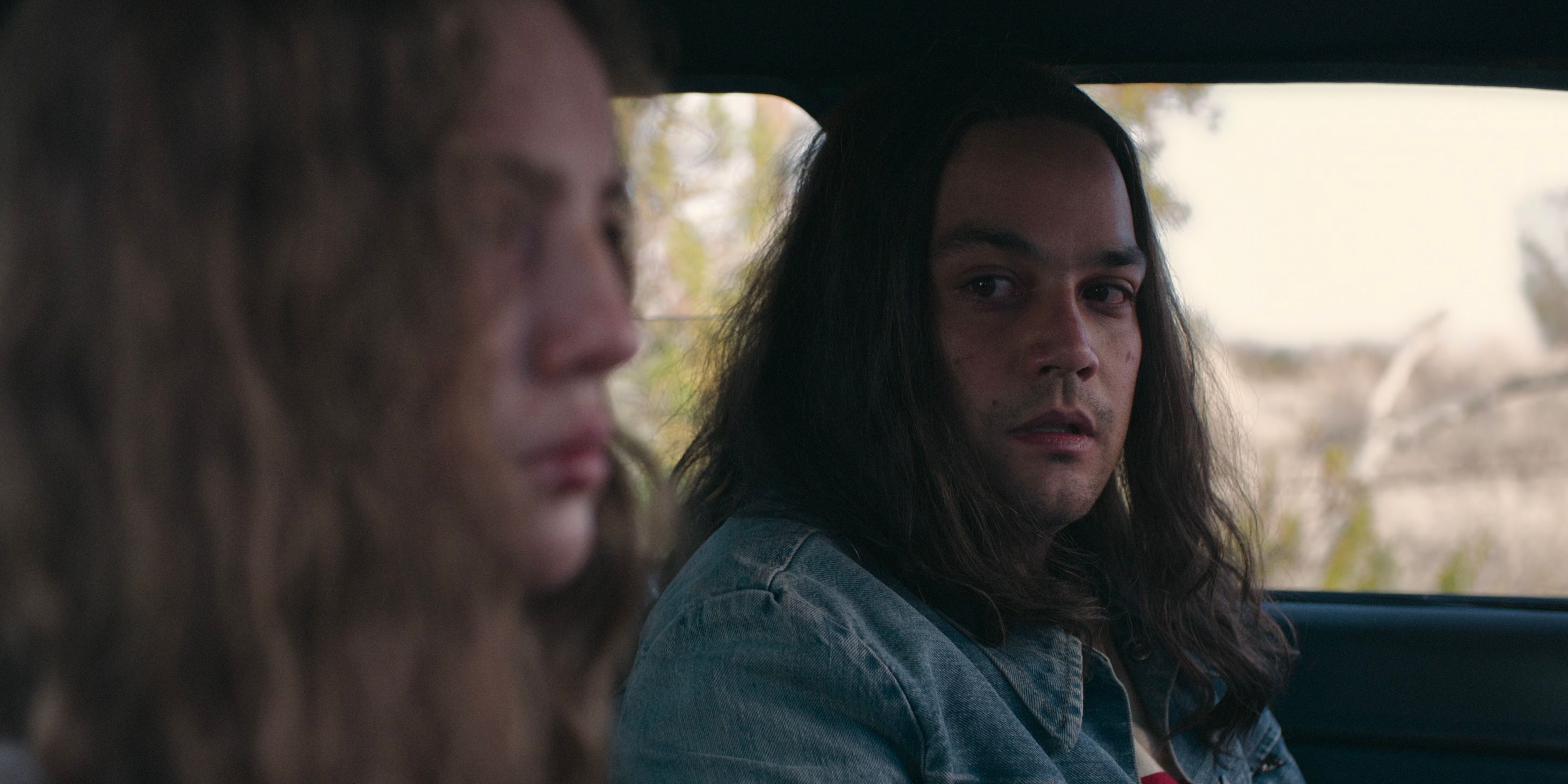 Amy (Autumn Best) and Rodney Alcala (Daniel Zovatto) in a car in Woman of the Hour