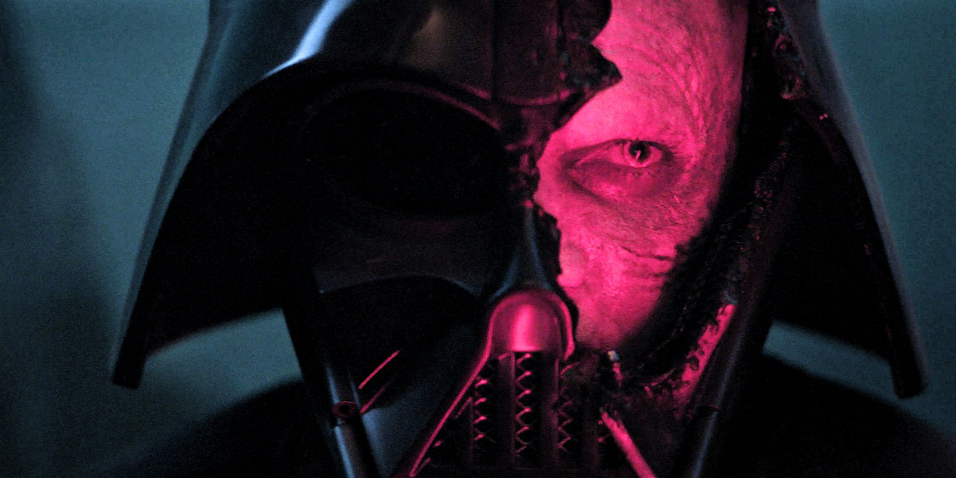 Anakin Skywalker's face lit red seend behind a cracked Darth Vader Mask from Star Wars Obi Wan Kenobi