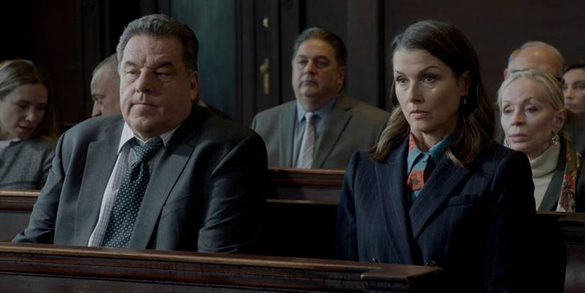 Anthony Abetemarco (Steve Schirripa) and Erin Reagan (Bridget Moynahan) sit during a court session.