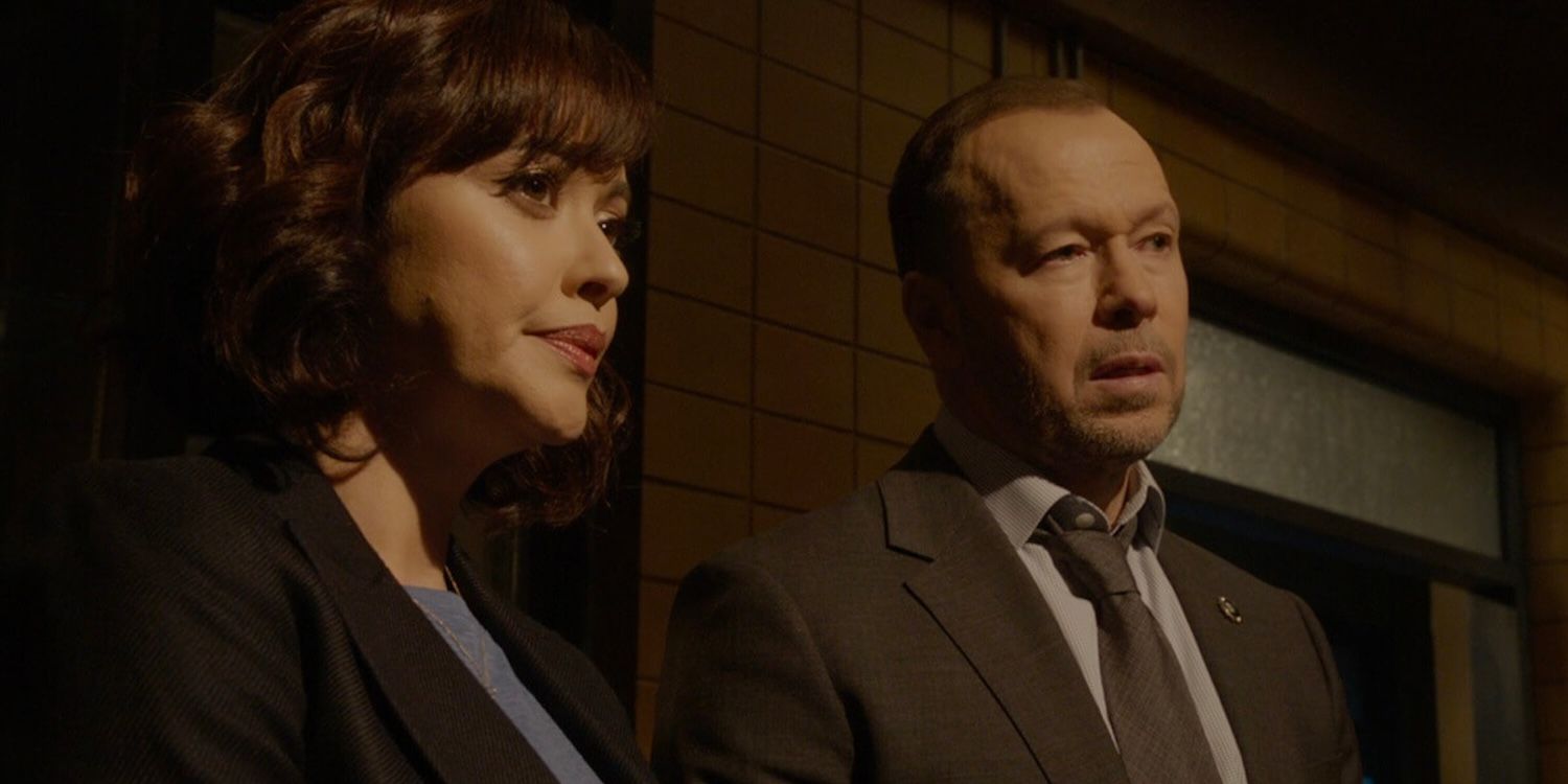 Maria Baez (Marisa Ramirez) and Danny Reagan (Donnie Wahlberg) stand in an interrogation hall looking concerned.