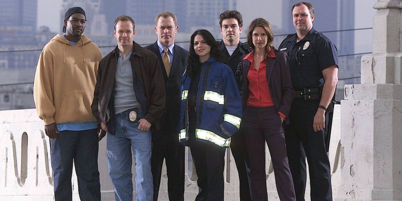 The cast of the 2002 show Boomtown posing for a cast picture