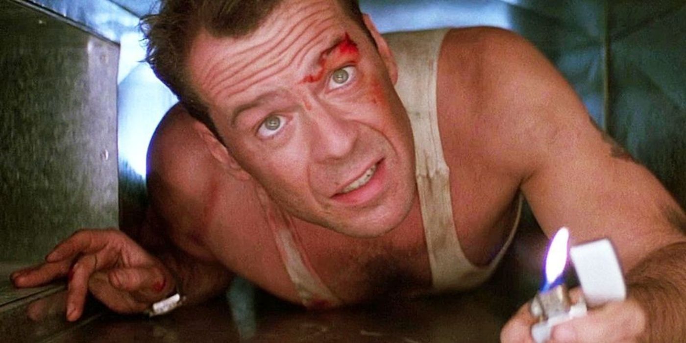 John McClane (Bruce Willis) is on his stomach in a vent in Die Hard.