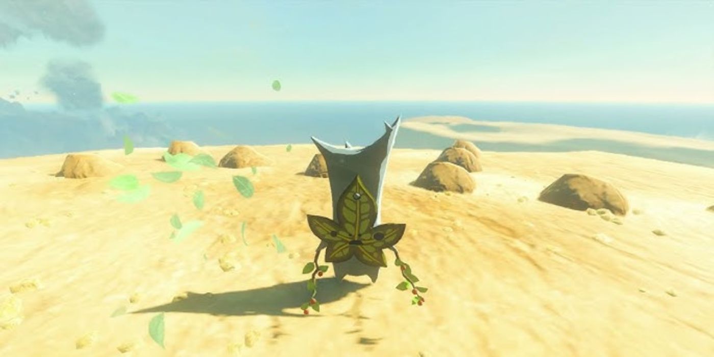 Um korok fica na frente de um quebra-cabeça de pedra em Tears of the Kingdom.