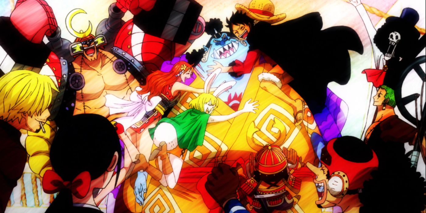 Jinbei está sendo abraçado por Nami, Carrot e Monkey D. Luffy enquanto o resto dos Chapéus de Palha, incluindo Robin, Sanji, Usopp, Tony Tony Chopper, Roronoa Zoro, Brook e Franky, o cercam e torcem durante seu reencontro em Wano de One Piece. Arco do país.