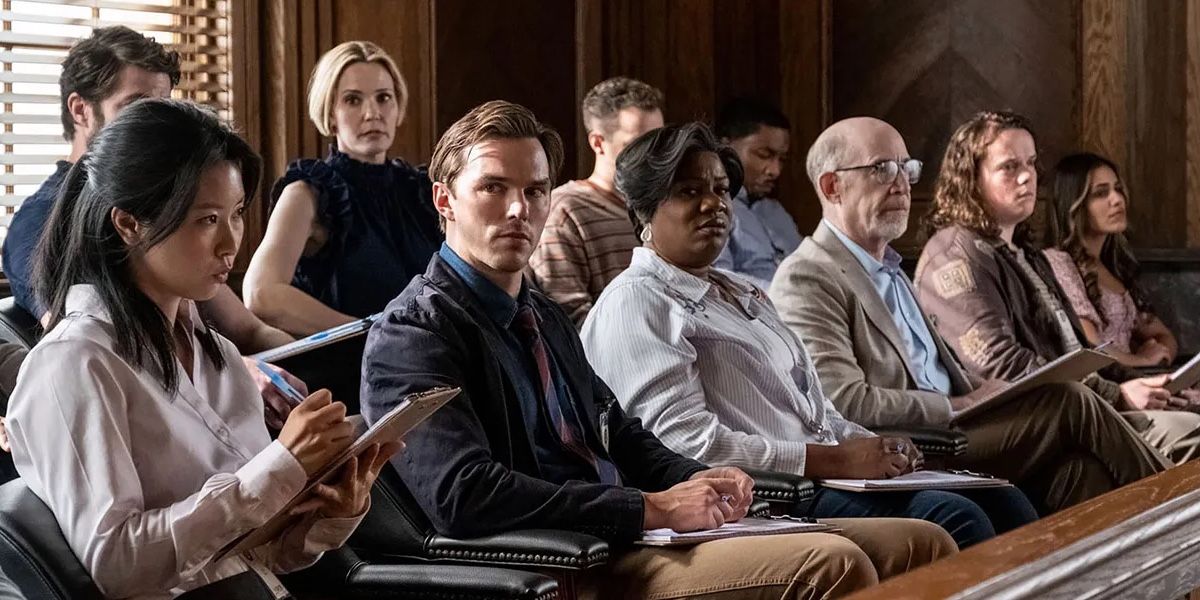 Justin Kemp sits with his fellow jurors in a courthouse