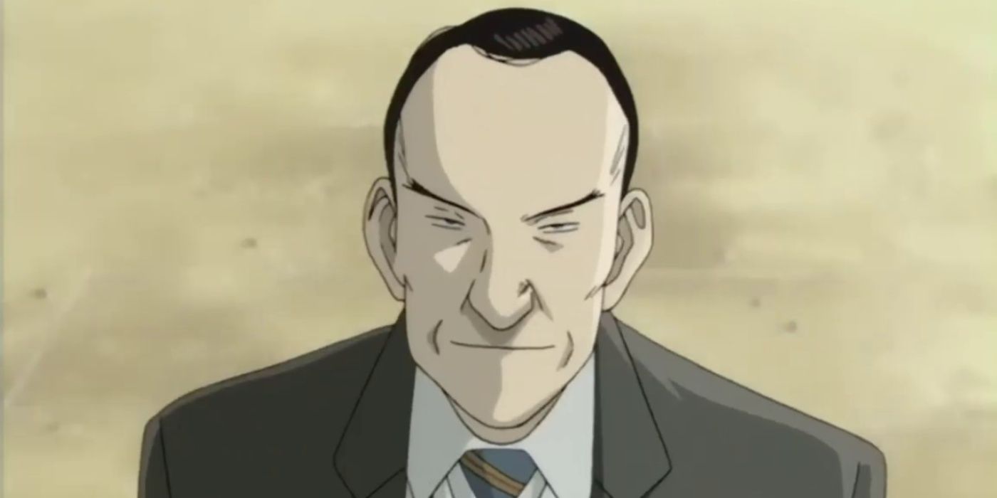 Inspector Heinrich Runge smiles while trying to interrogate Dr. Kenzō Tenma in Monster.