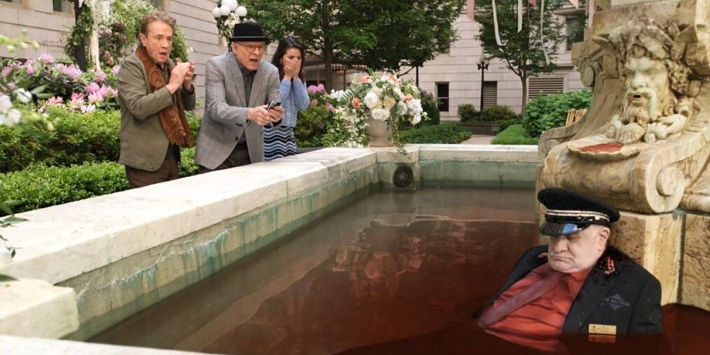 Oliver, Charles, and Mabel are horrified looking at Teddy dead in bloody water in the fountain in Only Murders in the Building.