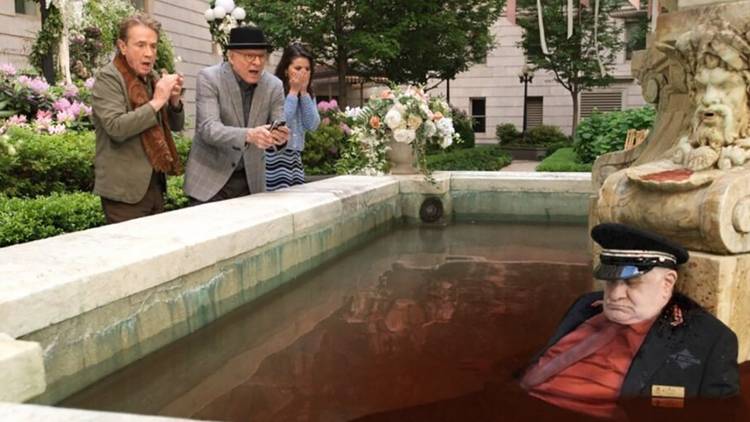 Oliver, Charles, and Mabel are horrified looking at Teddy dead in bloody water in the fountain in Only Murders in the Building.