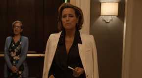 Sofia emerges from the elevator, Uma in the background inside the elevator in Only Murders in the Building.