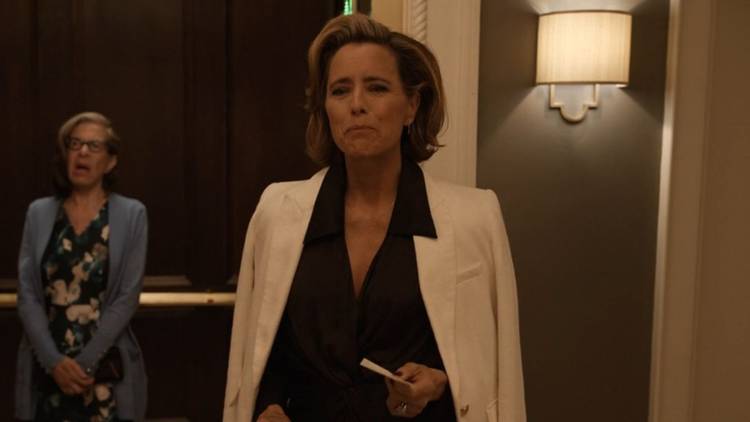 Sofia emerges from the elevator, Uma in the background inside the elevator in Only Murders in the Building.