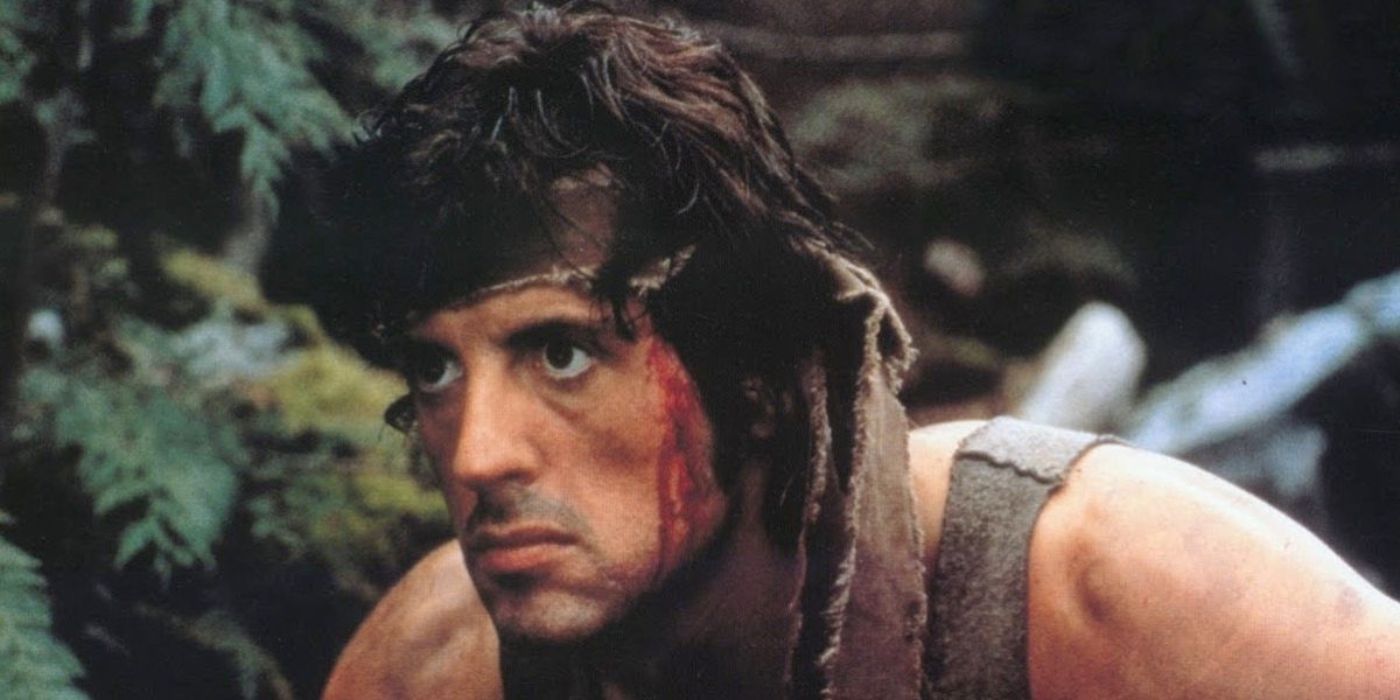 John Rambo (Sylvester Stallone) is staring intensely while blood trickles down his face in Rambo: First Blood.