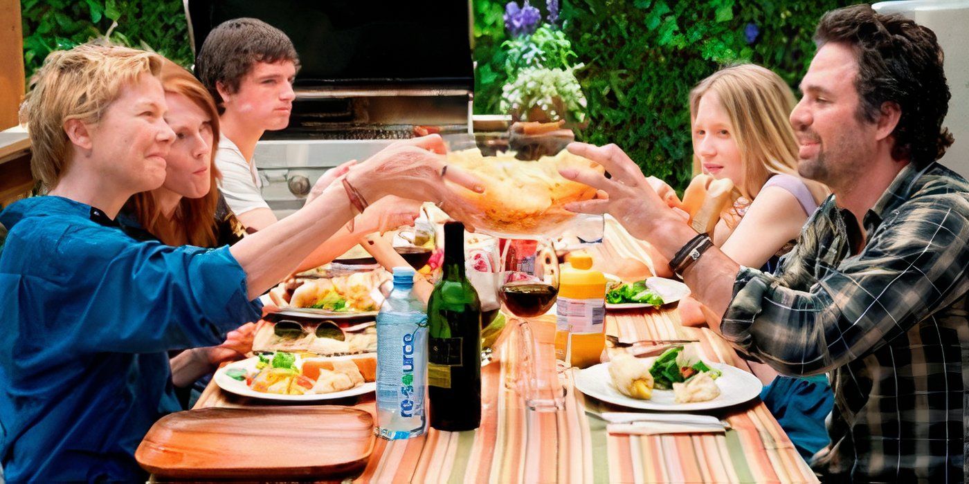 The family is eating together at an outdoor table in The Kids Are All Right