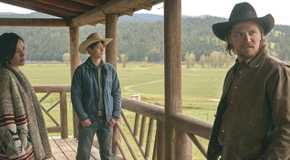Monica Long Dutton, Tate Dutton and Kayce Dutton stand on the porch of a log cabin in Yellowstone