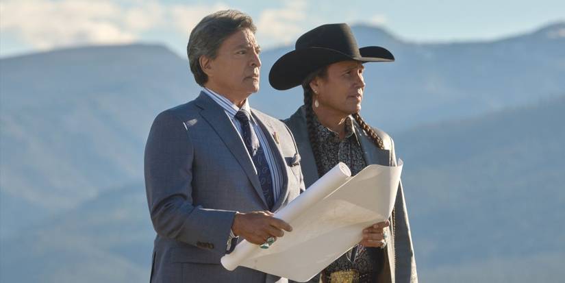 Thomas Rainwater (Gil Birmingham) holds plans while he and Mo (Moses Brings Plenty) at the horizon in Yellowstone.