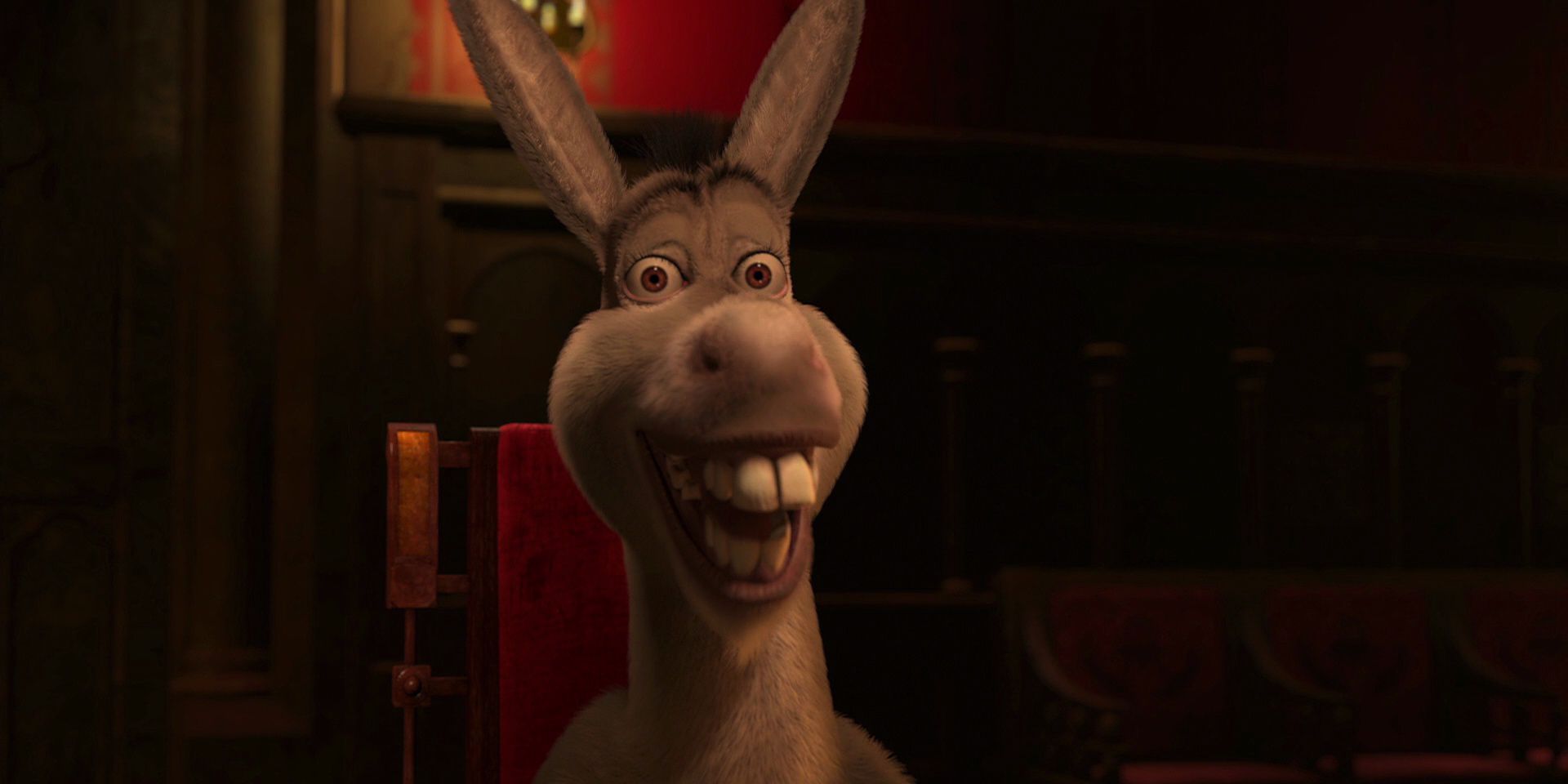 Donkey sonriendo después de gritar su nombre durante la escena de la cena real en Shrek 2