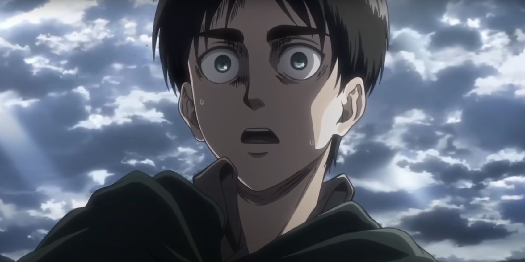 Eren Yeager looks shocked against a cloudy sky in Attack on Titan.