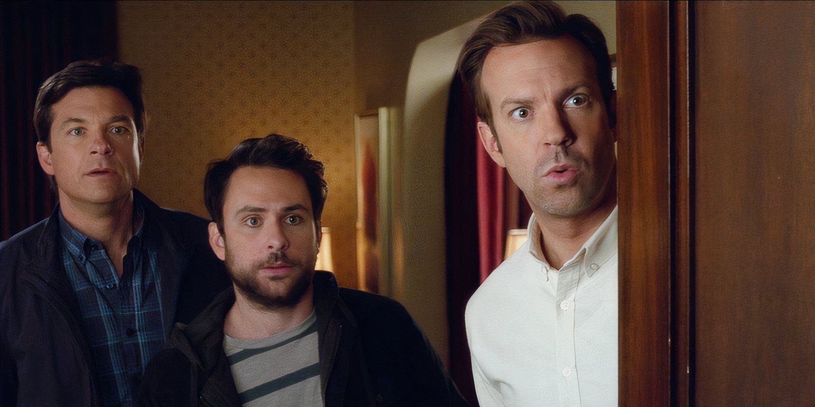 Jason Bateman, Charlie Day, and Jason Sudeikis look at someone off screen in Horrible Bosses movie