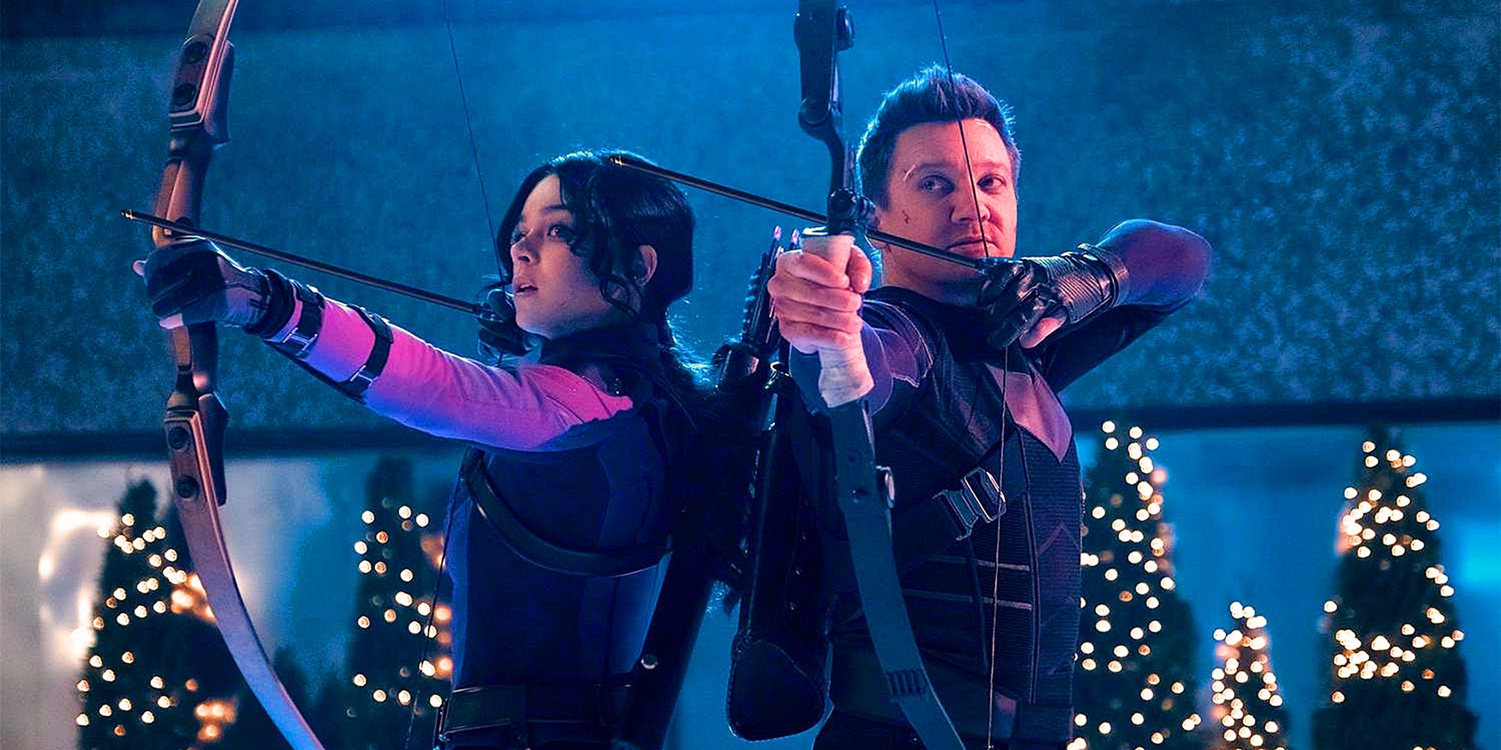 Kate Bishop and Clint Barton stand back to back with bows drawn in the Hawkeye series