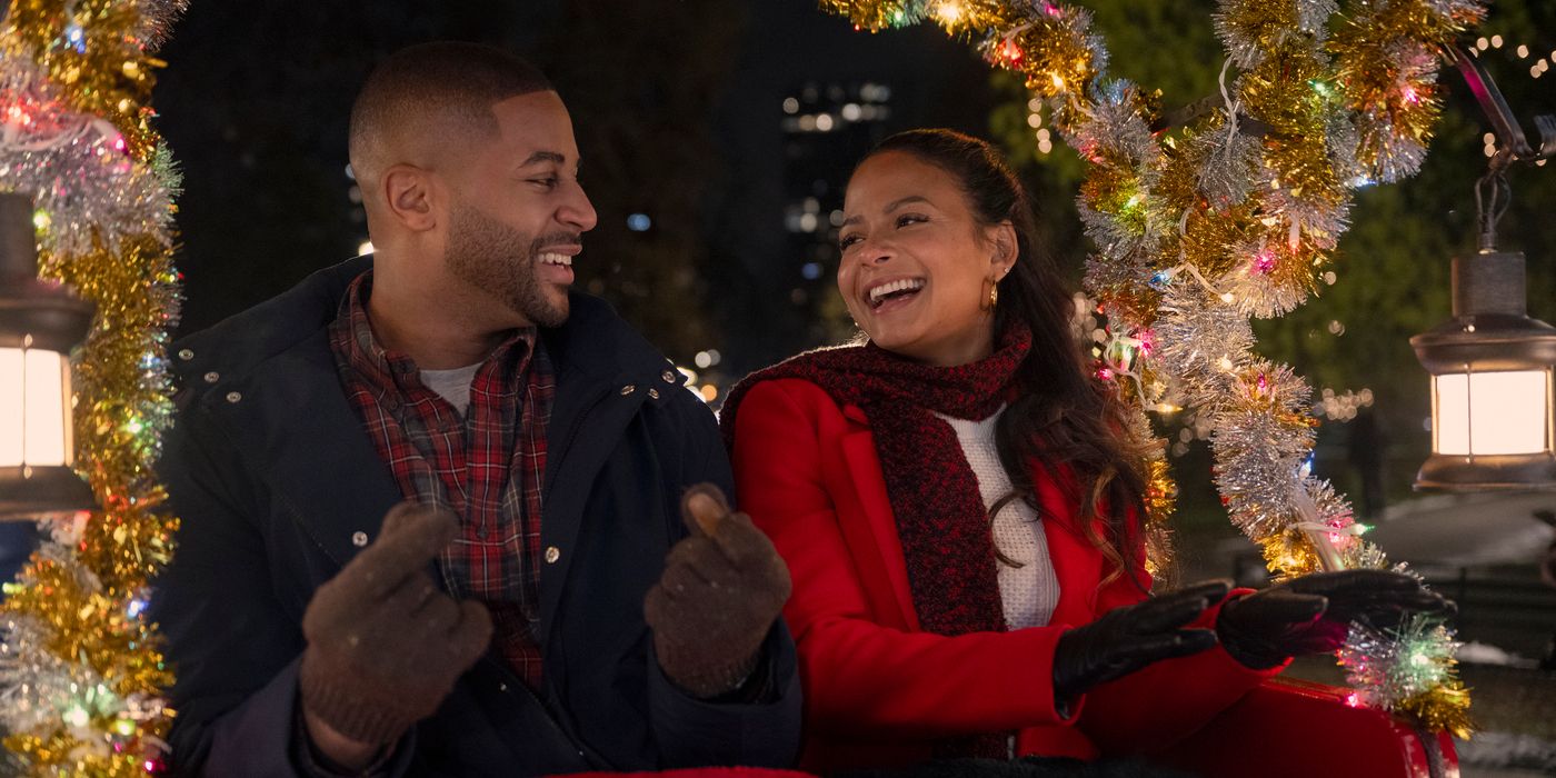 Teddy (Devale Ellis) e Layla (Christina Milian) riem em um passeio de carruagem em Meet Me Next Christmas