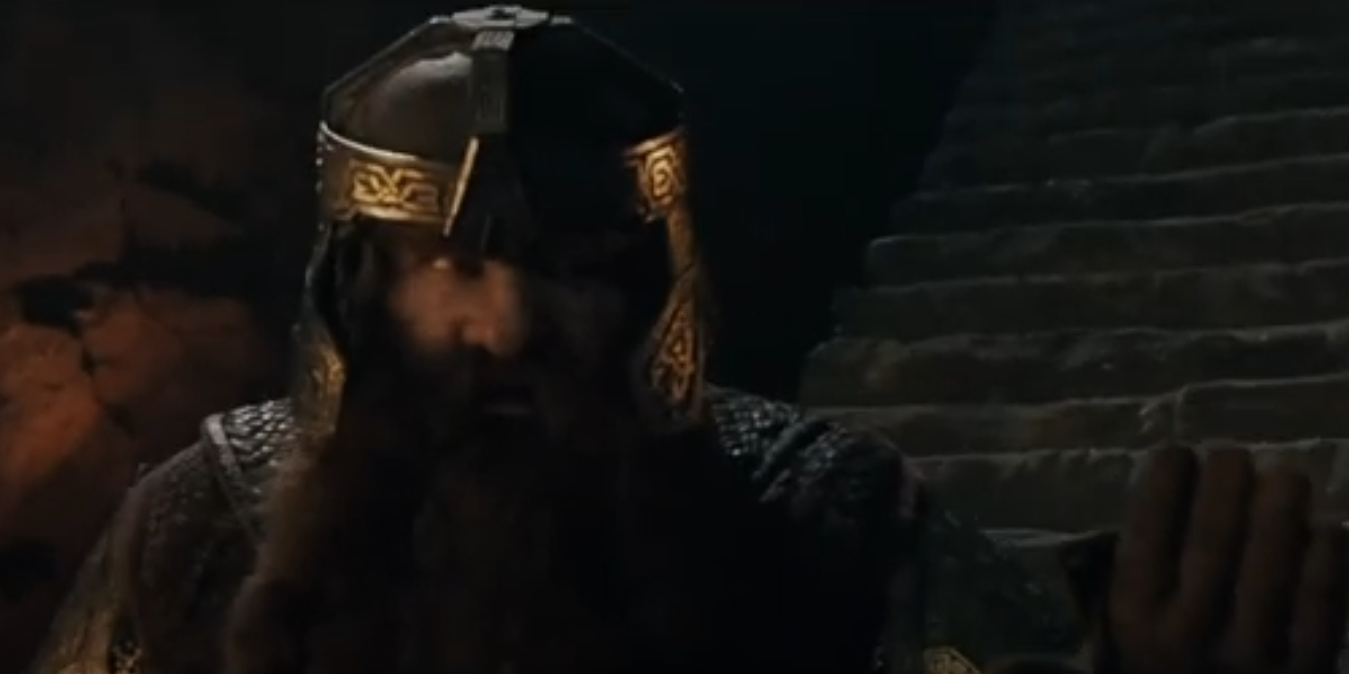 Gimli levanta a mão e se recusa a ser incluído na Sociedade do Anel.