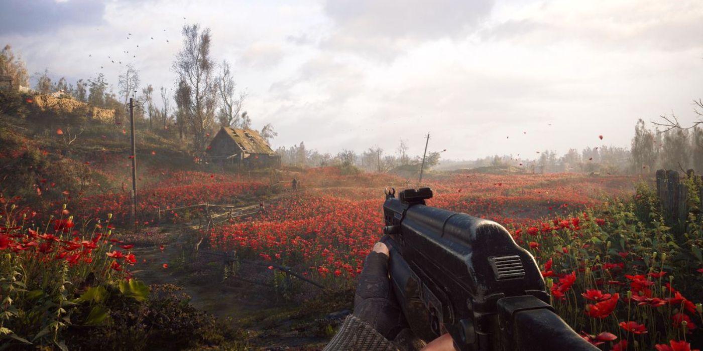 Skif explorando uma fazenda com flores vermelhas brilhantes em STALKER 2 Heart of Chornobyl