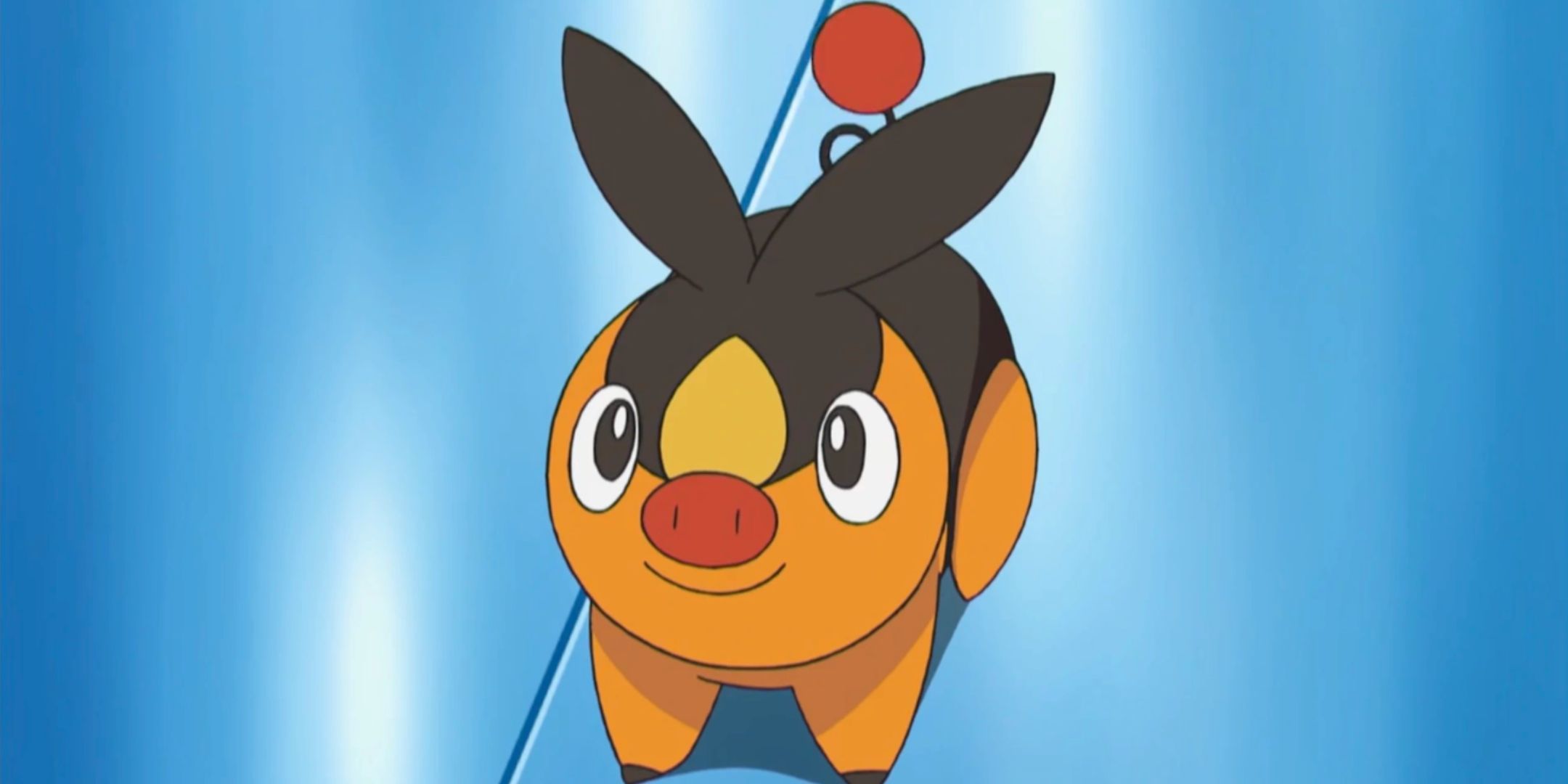 Um Tepig sorridente parado em um chão azul brilhante e olhando para o espectador em Pokémon