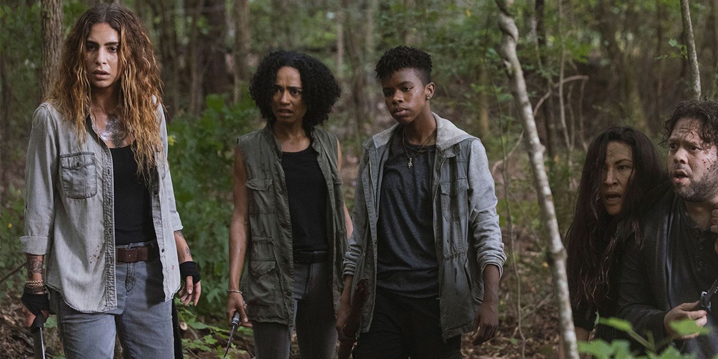 Magna, Connie, Kelly, Yumiko, and Luke looking scared in the forest in The Walking Dead.