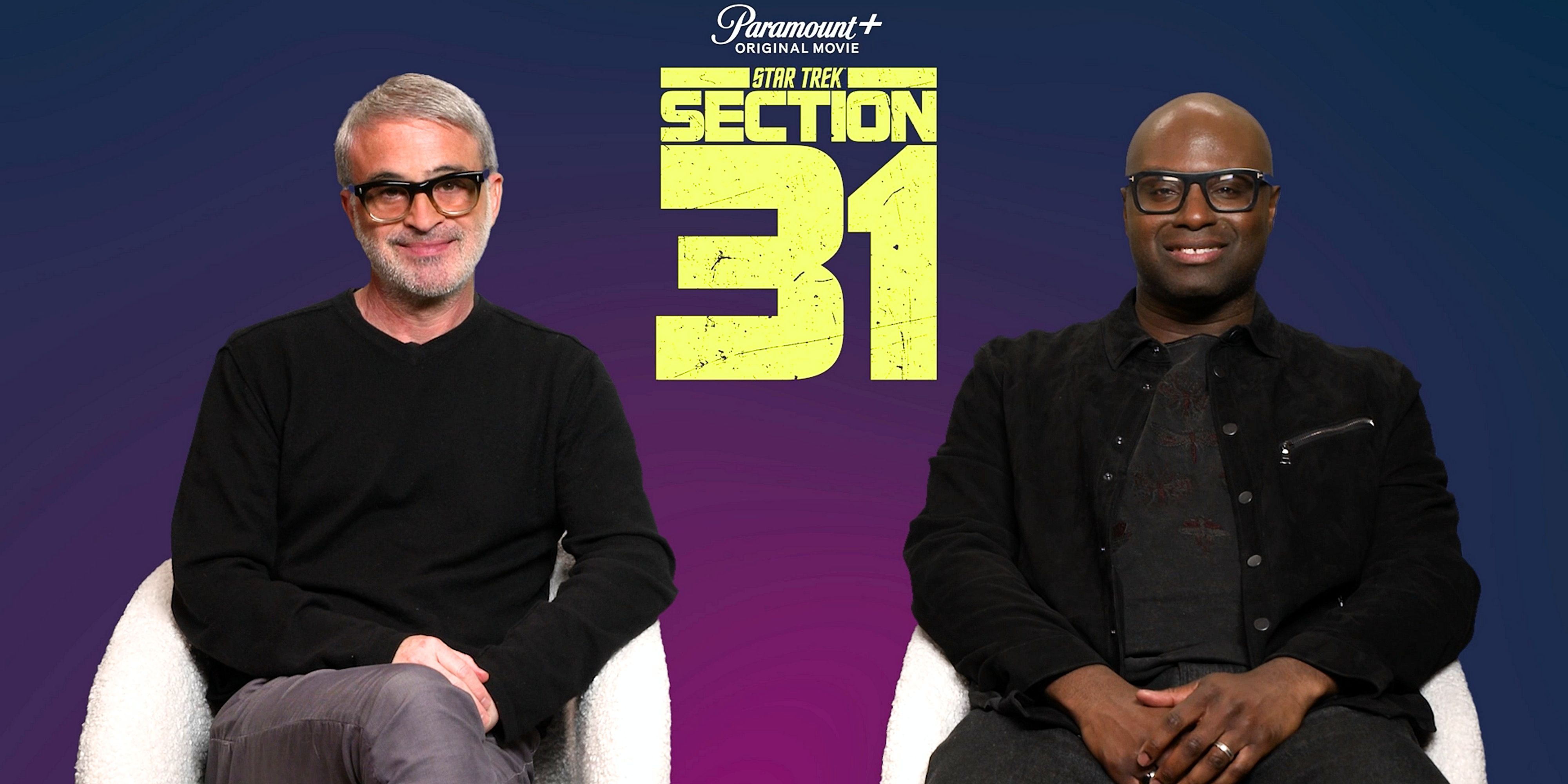 Alex Kurtzman and Olatunde Osunsami in front of a Section 31 banner cropped