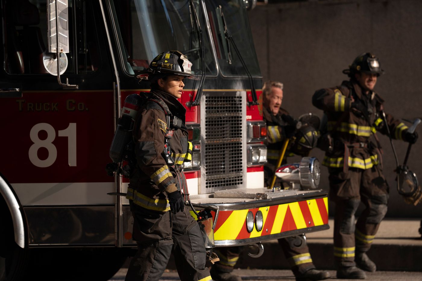 Stella Kidd (Miranda Rae Mayo) stands next to Truck 81 as she and her team step out in Chicago Fire