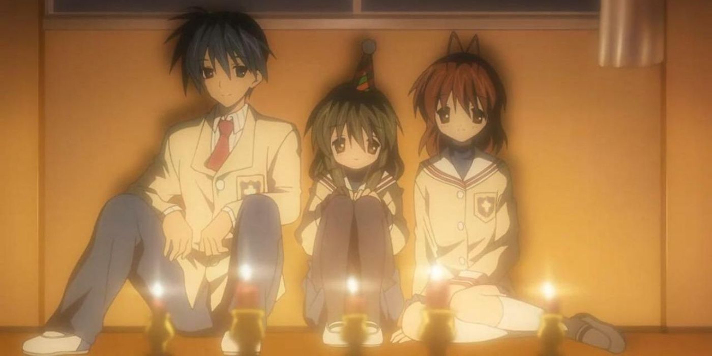 Tomoya, Nagisa, and Fuko are celebrating together in Clannad.