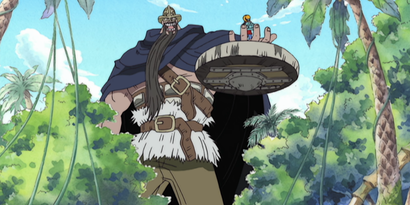 Dorry está conversando com Monkey D. Luffy enquanto segura o capitão do chapéu de palha na mão durante o pequeno arco do jardim de uma peça.