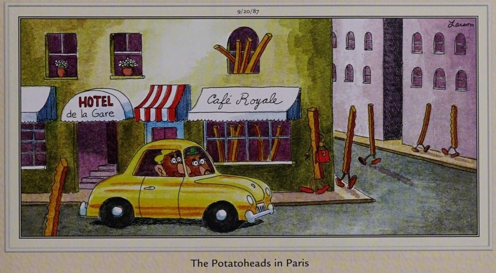 O Sr. e a Sra. Potatohead dirigem um carro amarelo através de Paris.