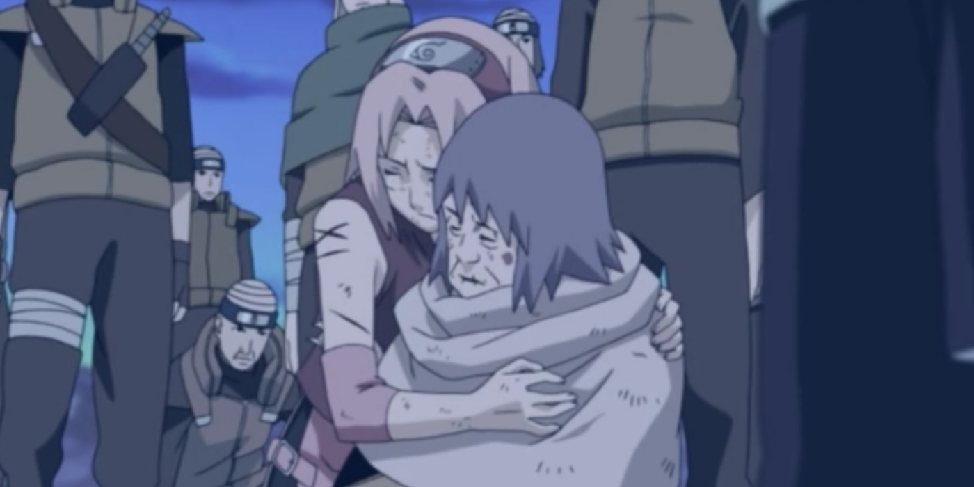 Sakura Haruno is cradling Lady Chiyo's dead body in Naruto: Shippuden.