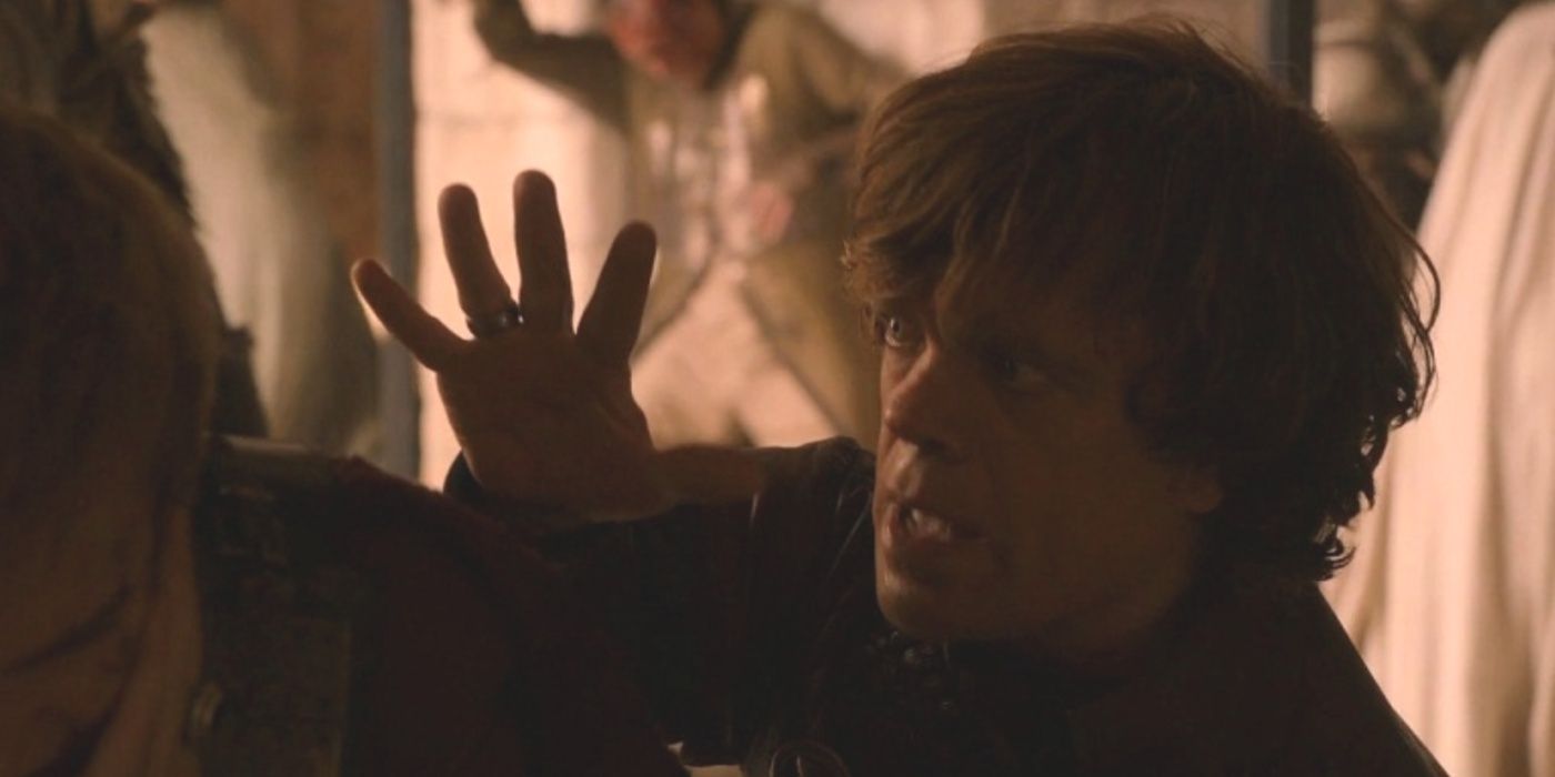 Tyrion estende a palma da mão aberta para Joffrey em Game of Thrones.