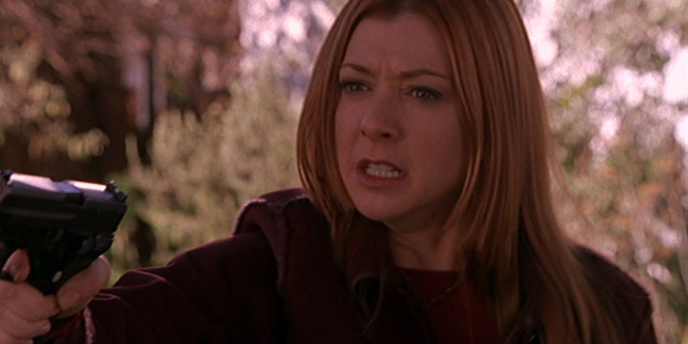 Willow holds a gun in Buffy the Vampire Slayer.